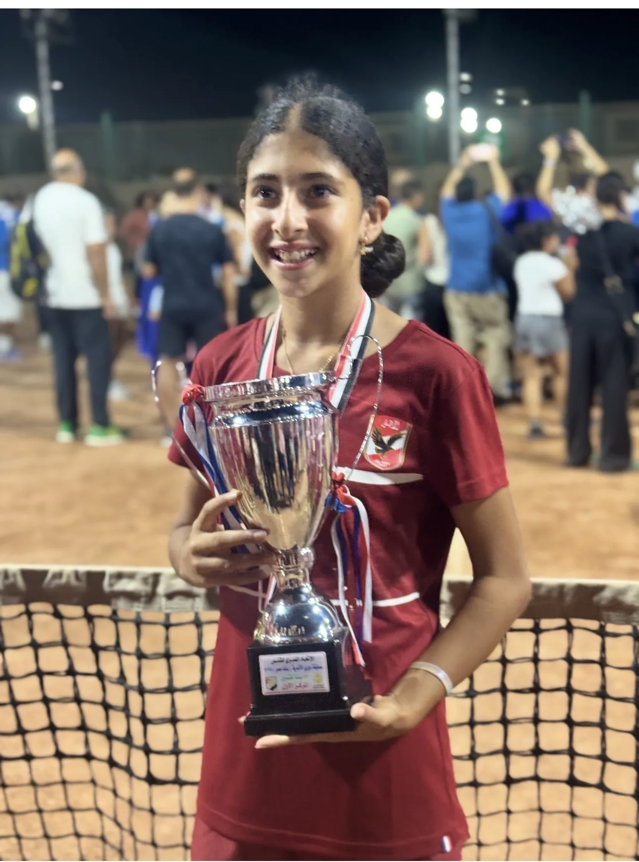 أمنية أحمد سمرة أثناء التتويج بإحدى بطولات التنس